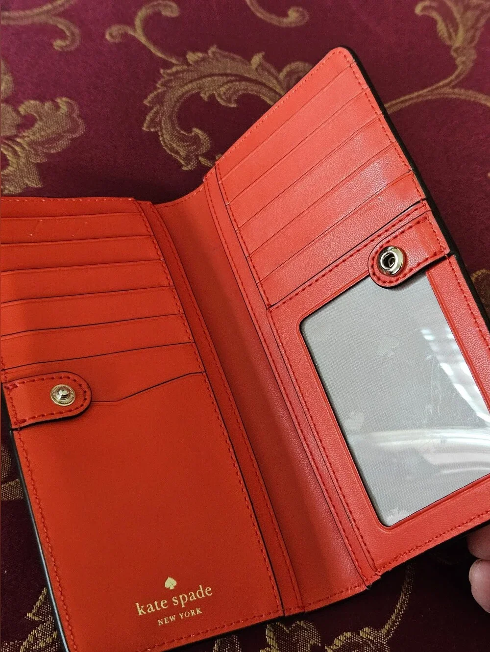 Kate Spade New York coral orange Saffiano leather continental wallet